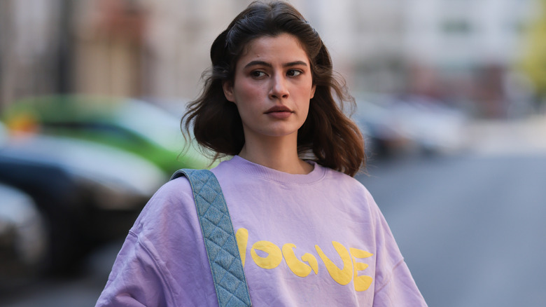 Woman with brown hair walking