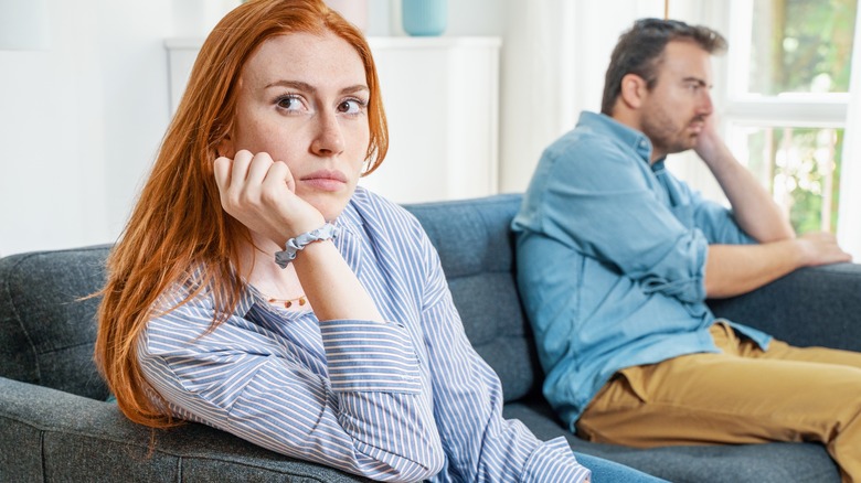 Upset couple on couch