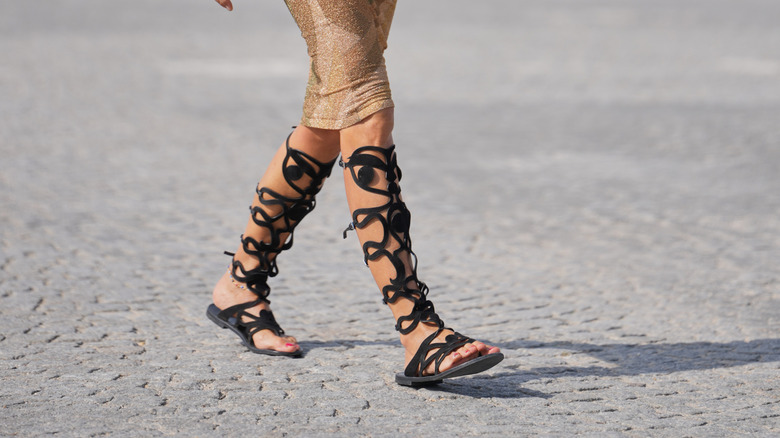 A guest, outside Dior, during Paris Fashion Week - Womenswear Spring Summer 2026