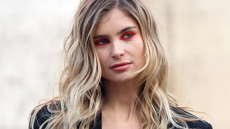 girl with red eye makeup 