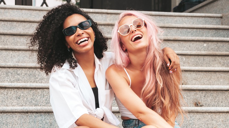 Women smiling on stairs 