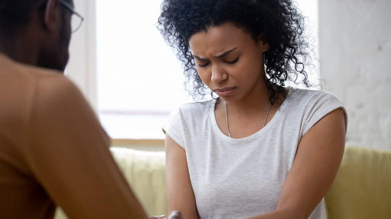 woman supporting grieving man