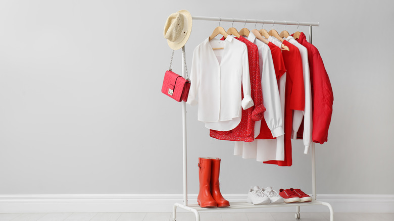 white and red garments on rack