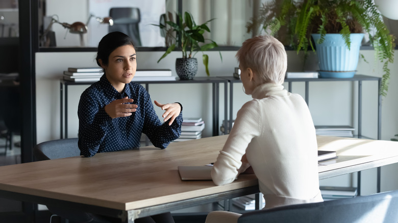 Woman talking to her boss