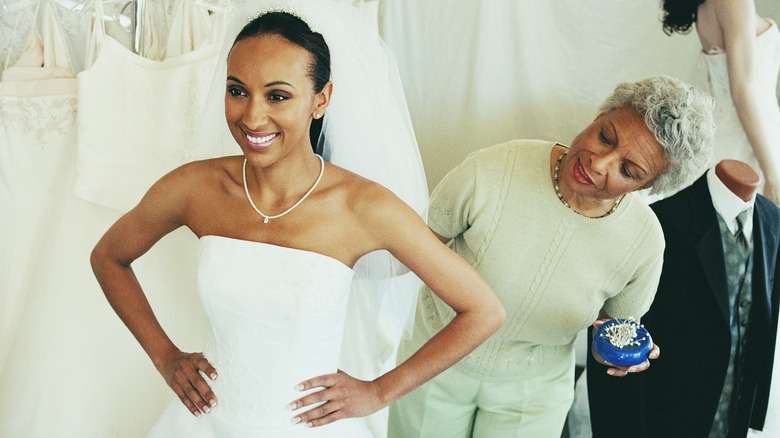 Woman trying on a wedding dress