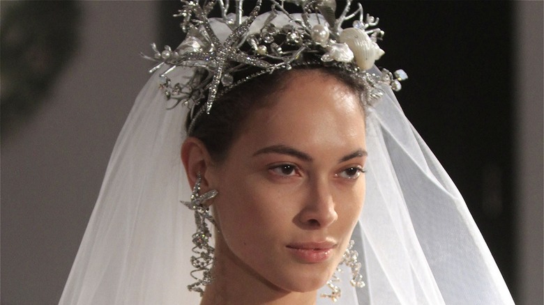 Model with veil, crown, and natural makeup