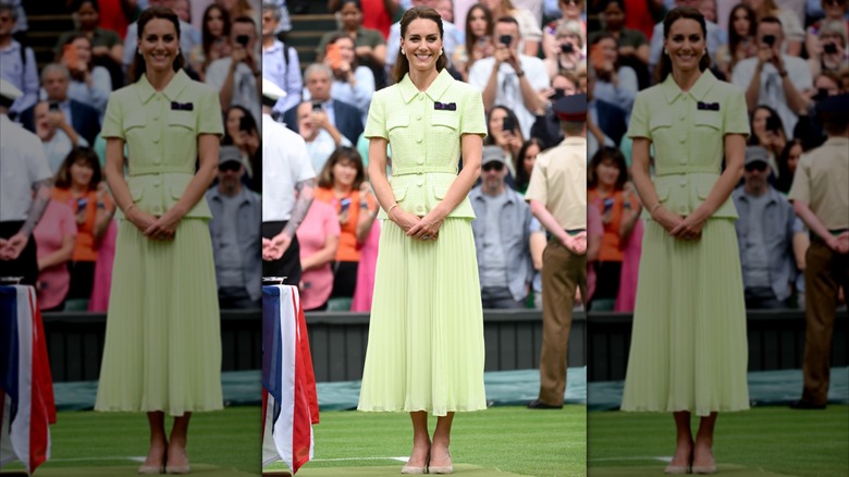 Kate Middleton wearing a lime-green pleated skirt with a button-up belted top at Wimbledon in 2023.