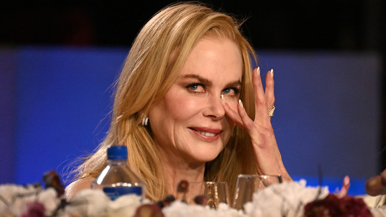 Nicole Kidman wiping away tears