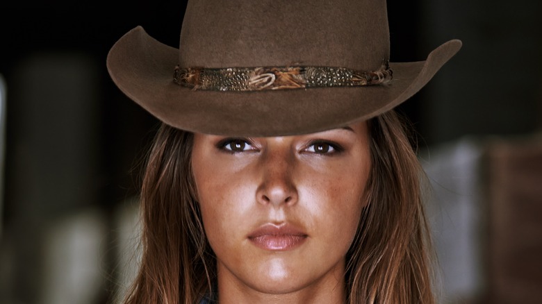 Woman wearing a cowgirl hat