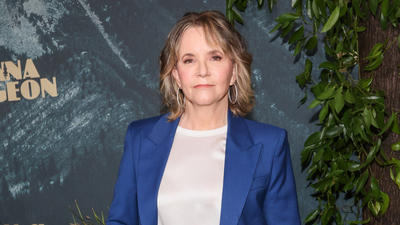 Lea Thompson wearing a blue suit