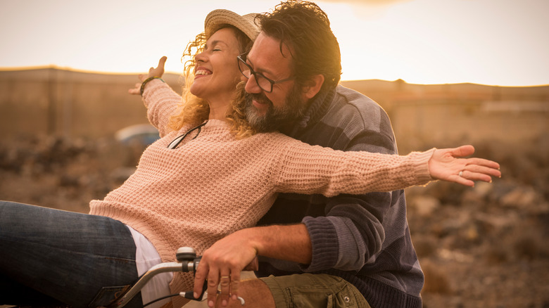 Couple riding a bike together