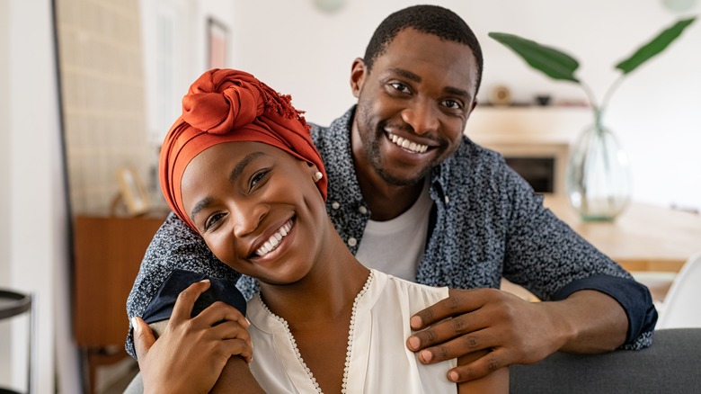 couple smiling and hugging