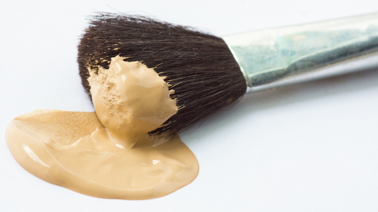 brush dipped in foundation 
