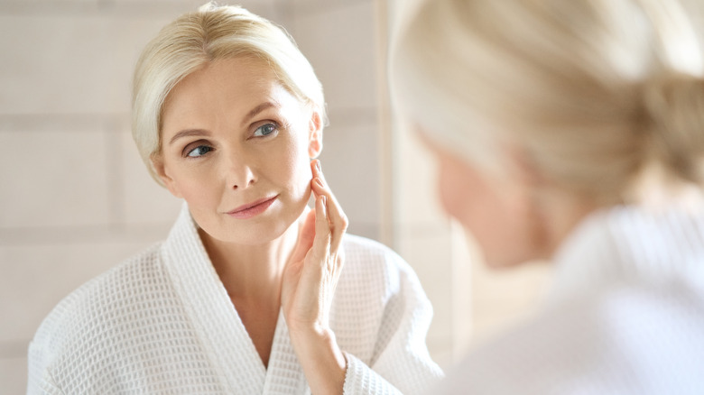 Woman looking in the mirror
