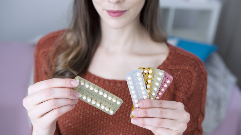 Woman with birth control pills