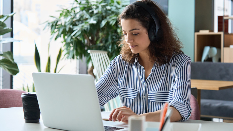 Woman takes test on laptop