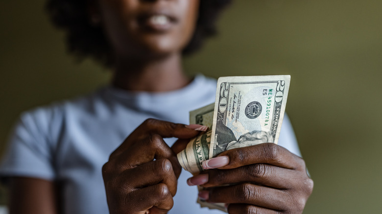 woman counting cash