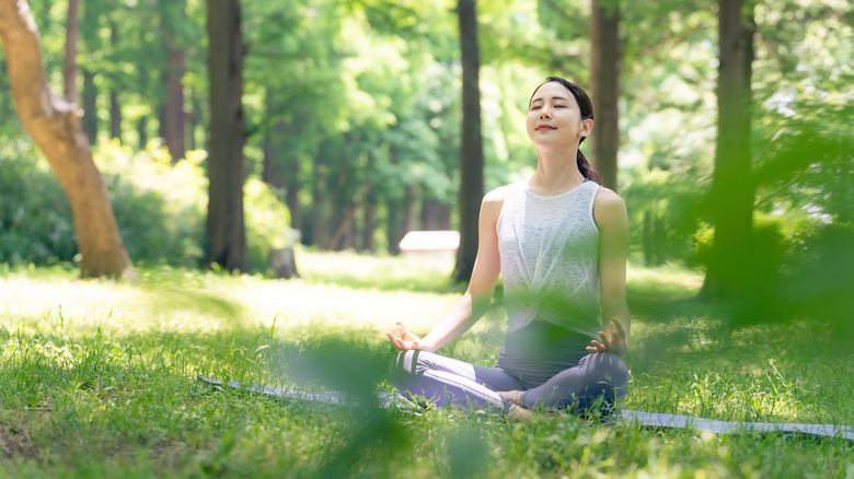 woman meditating outside