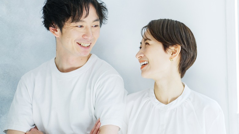Young Asian couple laughing together