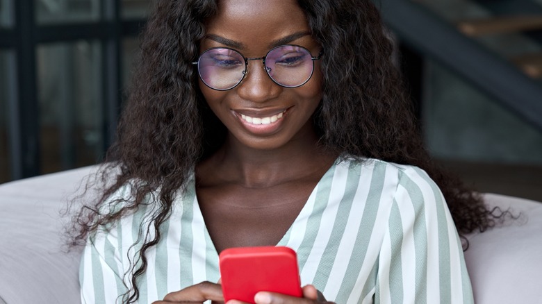 woman holding phone