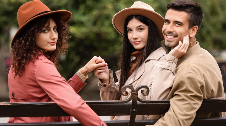 three people on bench