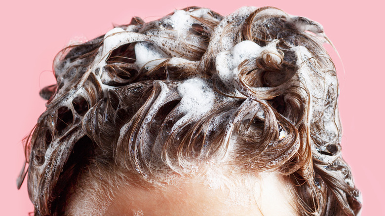 Suds in hair.