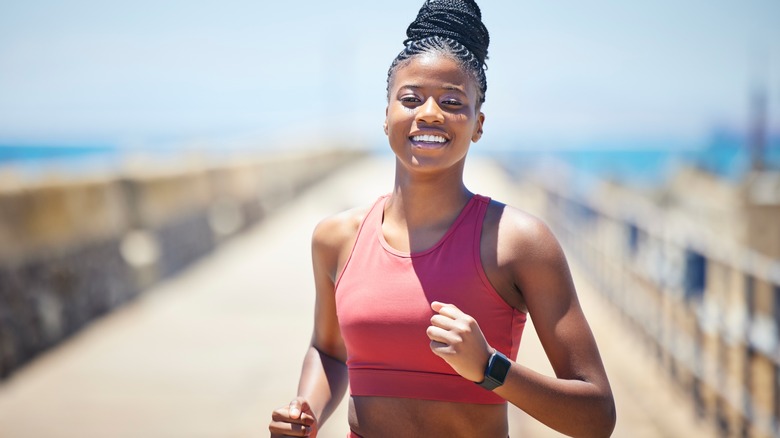 woman running outdoors in sun