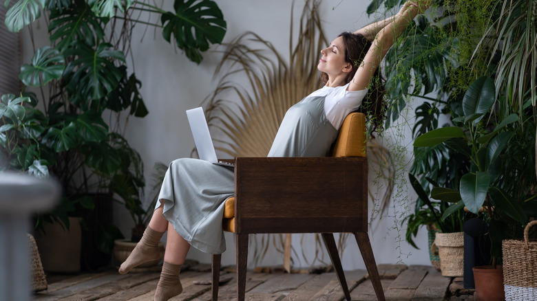 Relaxed woman with laptop