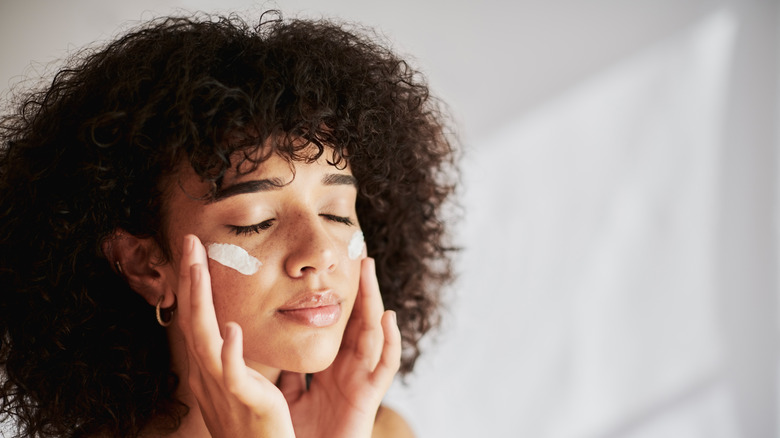 Woman applying cream