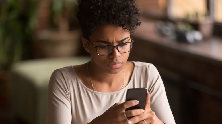 woman holding phone