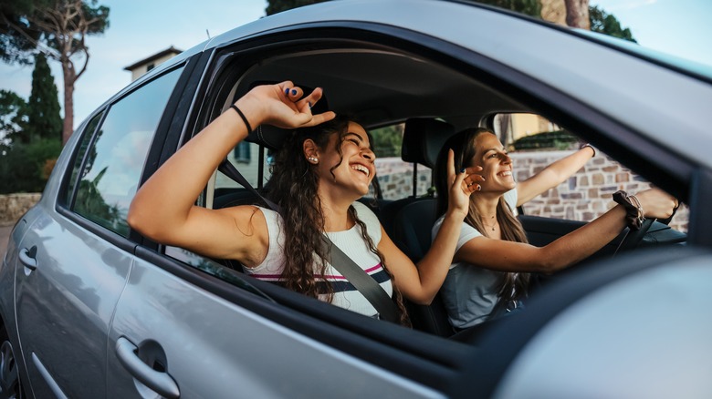 happy friends in car