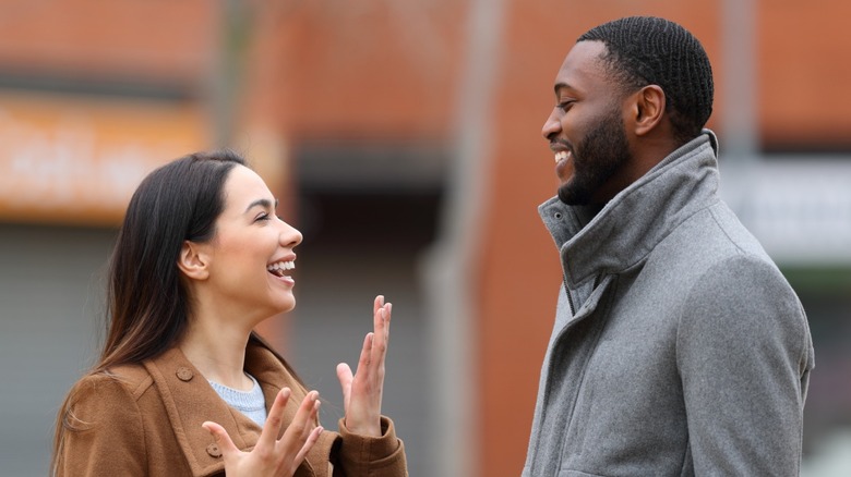 Man and woman laughing