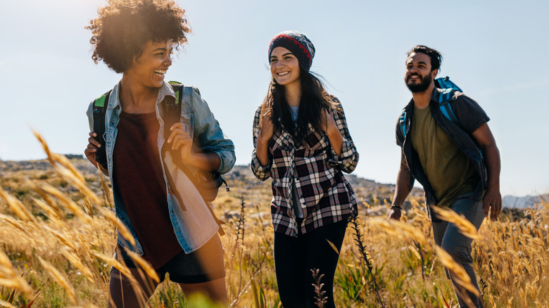 Three friends enjoying nature walk