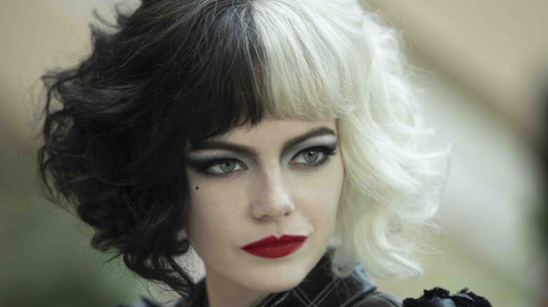 Emma Stone as Cruella with skunk hair