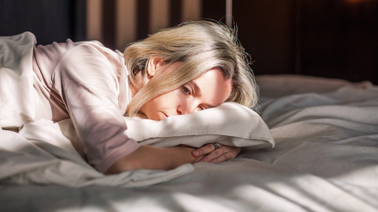 person depressed in bed