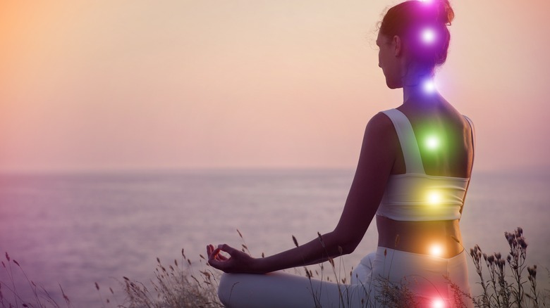 woman with glowing chakras