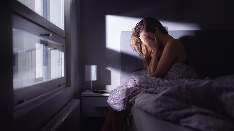 Woman waking up after a nightmare