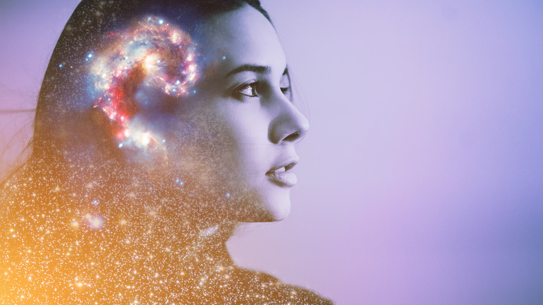 woman is cosmic glitter background