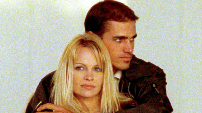 Kelly Slater cuddles Pamela Anderson in 2000.