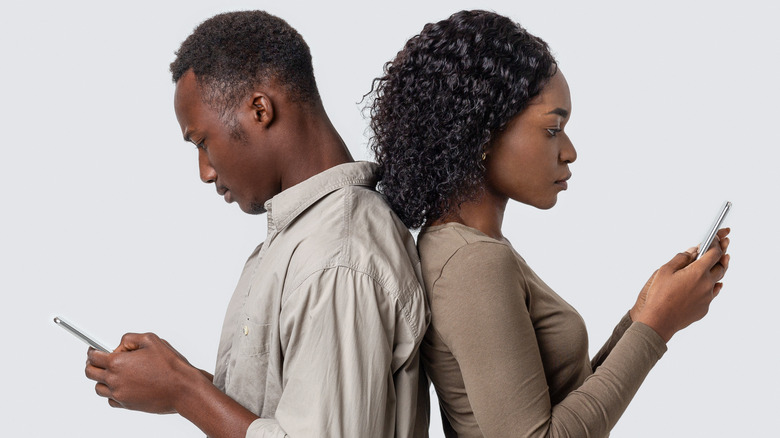 couple looking at phones