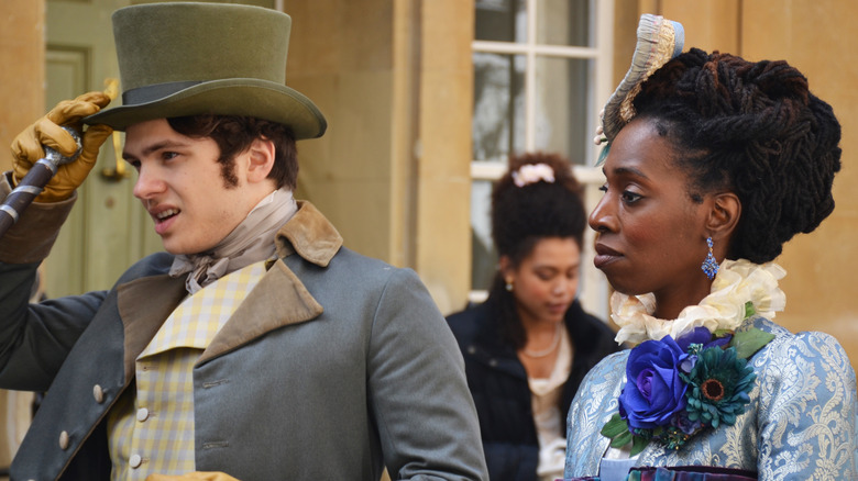 a man and a woman in Victorian costume