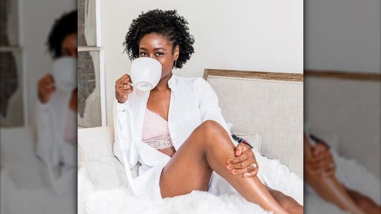 Black woman wearing blush pink bra