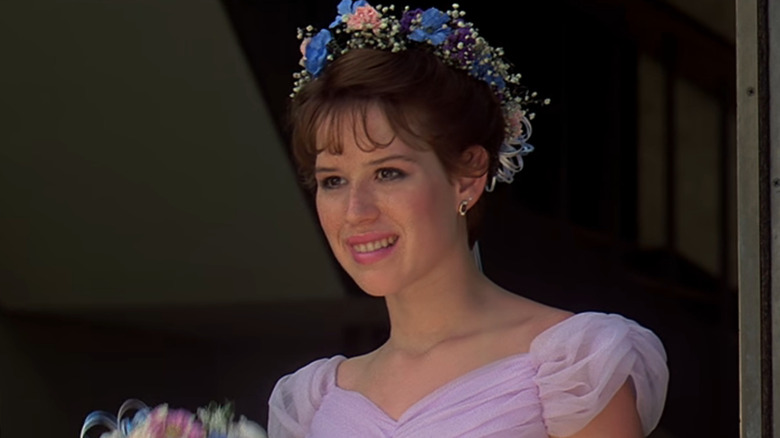 Molly Ringwald wearing a flower crown in 