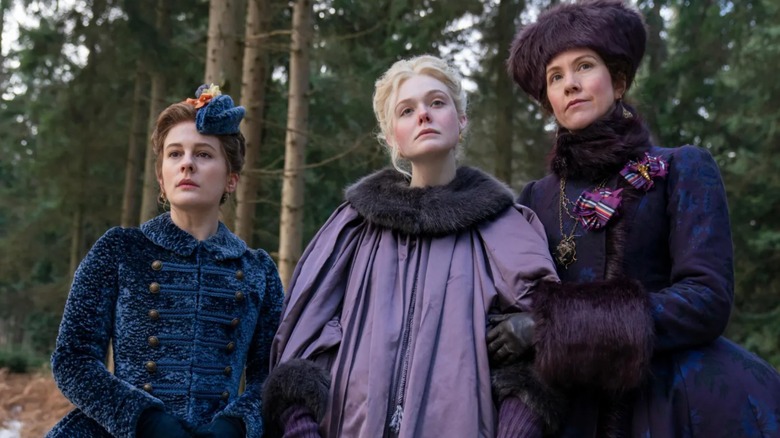 Actors Phoebe Fox, Elle Fanning, and Belinda Bromilow are pictured in a scene from Hulu's The Great