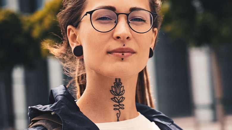 female neck tattoo