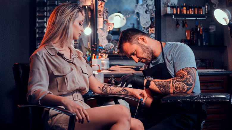 woman getting a tattoo