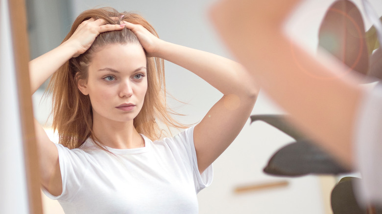 Woman looking at her hair