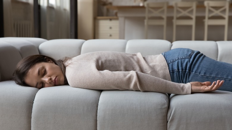 Woman lying on couch