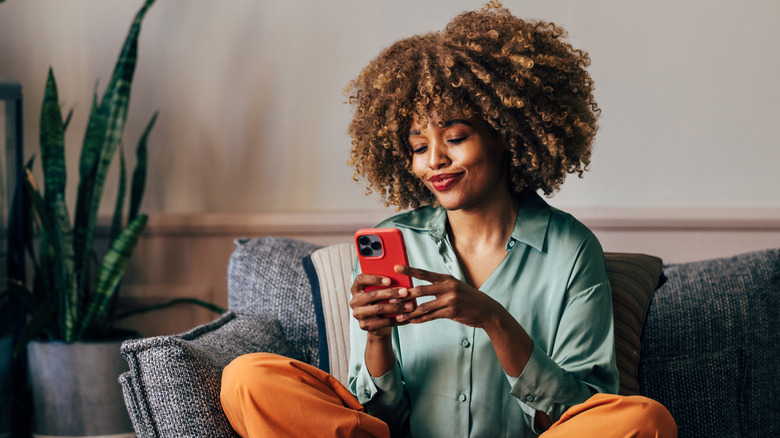 woman looking at phone