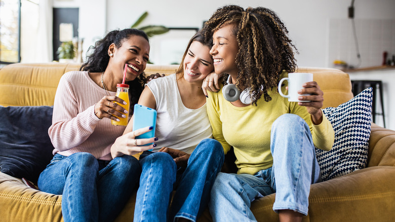 Three women laughing together